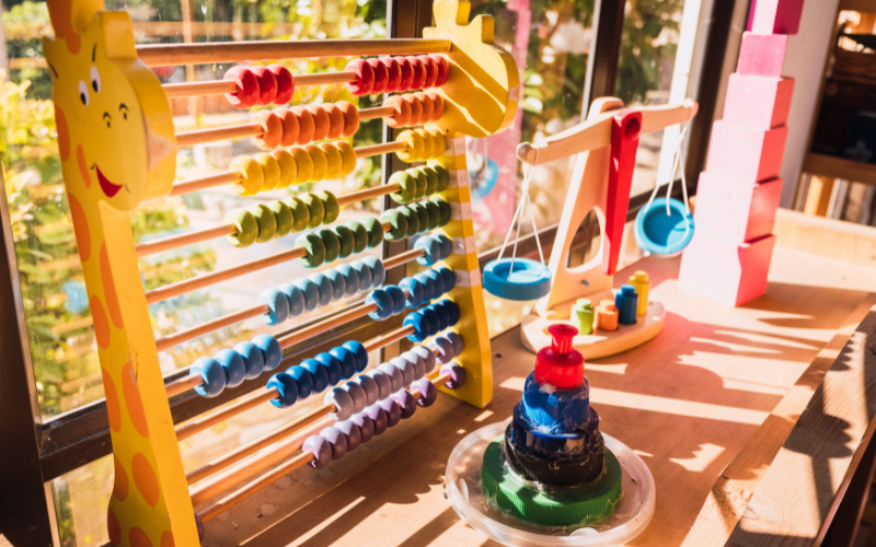 Daycare classroom with toys, cubbies, and child-friendly furniture — environments requiring strict life-safety and air quality inspection.